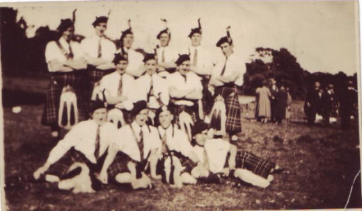 Group of Bandsmen with 1930’s tartan and tassles